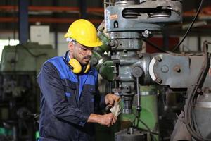 Professional men engineer worker skills quality, maintenance, training industry factory worker , warehouse Workshop for factory operators, mechanical engineering team production. photo