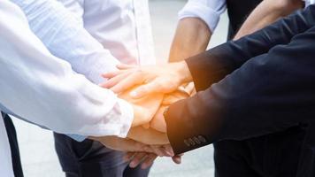 Lowsection Of Businessmen Shaking Hands, Business handshake, deal made. professionals photo