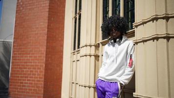 Portrait of young African American hipster man posing at outdoor. photo