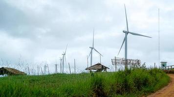 The wind turbine power working, blue sky, energy power concept photo