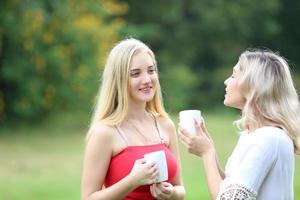 Portrait of two young friends outdoors. photo