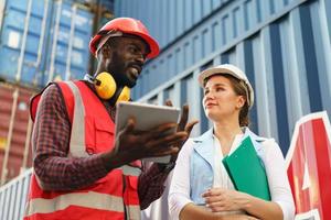 foreman checking containers in the terminal, at import and export business logistic company. photo