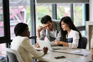 Group of diverse business people collaborating in office or Multiethnic business people in meeting. photo