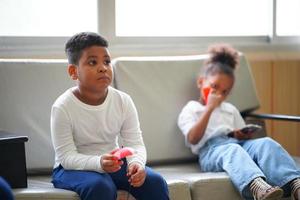 portrait of mixed race kids waiting doctor in hospital. photo