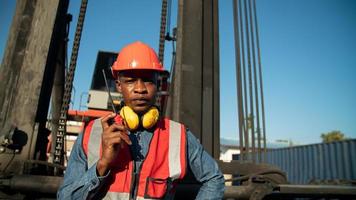 foreman checking containers in the terminal, at import and export business logistic company. photo