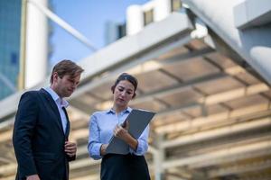 Business people discussing while walking together outdoor photo