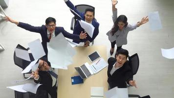 Successful business people standing together widen out showing strong relationship of worker community. A team of businessman and businesswoman expressing a strong group teamwork at the modern office.