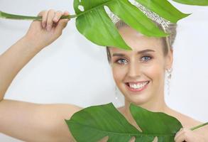 Portrait Of Smiling Young Woman Over white gray  Background photo