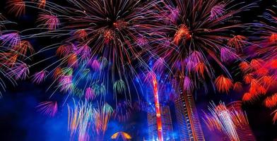 Colorful fireworks in celebrate new year at Chao Phraya river in Bangkok, Thailand. photo