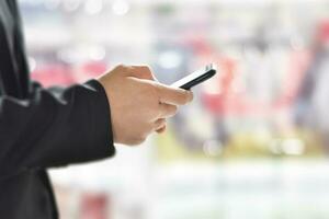 Close up of man hand using smartphone. Idea for business, online banking, technology, send sms. photo