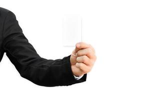 Man's hand in suit holding white business card isolated on white background, with clipping path. photo