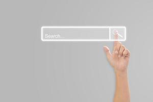 Hand click search button page on virtual screen. Idea for searching browse data information networking. Copy space for text. photo