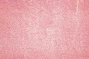 vintage de fondo de textura de yeso rosa claro. superficie de pared de cemento pintada abstracta. foto