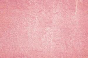 Vintage of light pink plaster texture background. Abstract painted cement wall surface. photo