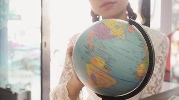 Women explore the globe to plan their trip photo