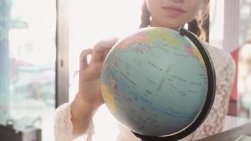 Women explore the globe to plan their trip photo