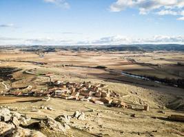 Landscape of a small village on the edge of a cliff photo