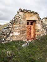 Entrances to subway cellars built in stone, in the village of Soria. hobbit houses photo