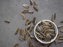 Sunflower seeds in white bowl. photo