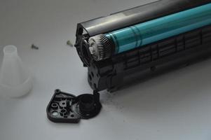 Charging the laser printer cartridge with toner powder photo