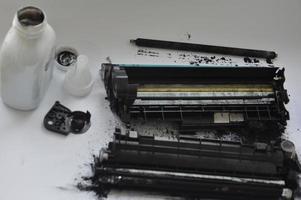Charging the laser printer cartridge with toner powder photo