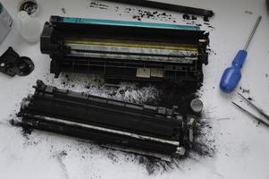 Charging the laser printer cartridge with toner powder photo