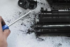 Charging the laser printer cartridge with toner powder photo