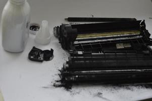 Charging the laser printer cartridge with toner powder photo