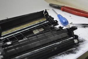 Charging the laser printer cartridge with toner powder photo