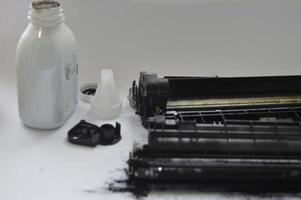 Charging the laser printer cartridge with toner powder photo