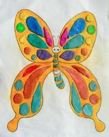 Molding of plasticine on a sheet of paper, in the form of a butterfly pattern. photo