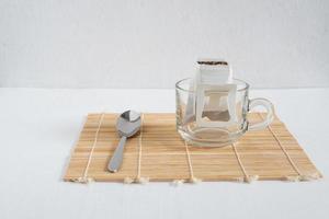 Dipping Coffee on white wood table photo