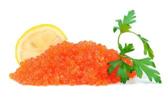 caviar red in a glass jar with lemon and parsley photo