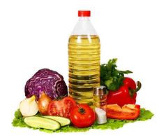 sunflower seed oil and vegetables for preparation of salad photo