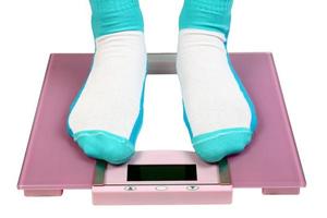 woman feet on floor scales photo