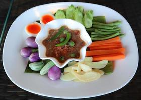 Nam Prik Kapi, Spicy shrimp paste sauce served with mixed vegetables. photo