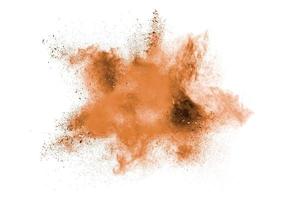 Brown powder splattered on white background. photo