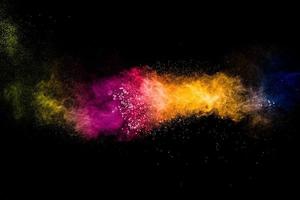 Multicolored powder explosion on black background.Colorful of pastel powder explosion. photo