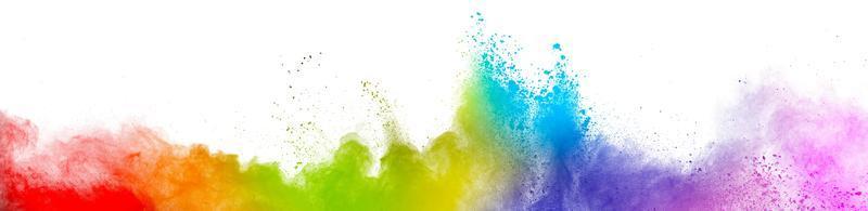 Colorful rainbow holi paint. Vivid color powder explosion isolated on white wide panorama background. photo