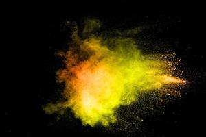 The explosion of colorful pigment powder on black background. Vibrant color dust particles textured background.