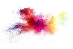 Colorful powder explosion on white background. Abstract pastel color dust particles splash. photo