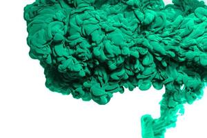 Green acrylic ink in water.Abstract paint splash cloud isolated on white background. photo