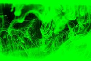 Abstract green acrylic ink background. Dramatic green wave in black. photo