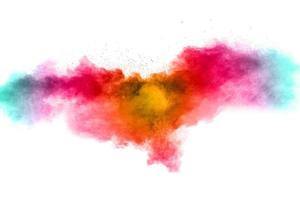 Colorful background of pastel powder explosion. Rainbow color dust splash on white background.