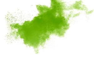 Green color powder explosion cloud on white background. Green dust splash. photo