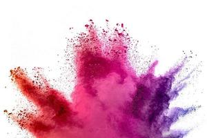 Abstract multicolored powder splash on white background.Freeze motion of color powder exploding. photo