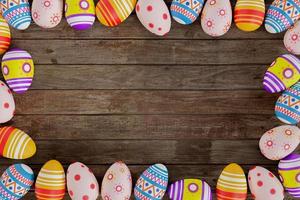 Colorful Easter eggs on wood 3D render photo