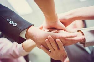 Success Teamwork Concepts, Business people with joined hands as a team, Group of diverse hands together joining, Young business people putting their hands together photo