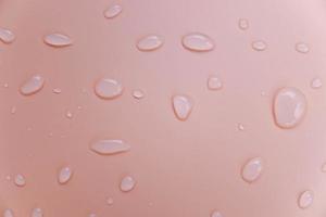 Drops of water on a pink color background. Pink. Shallow depth of field. Selective focus. Toned. photo