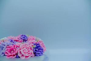 Jelly pink flower cake in white background for copy space photo